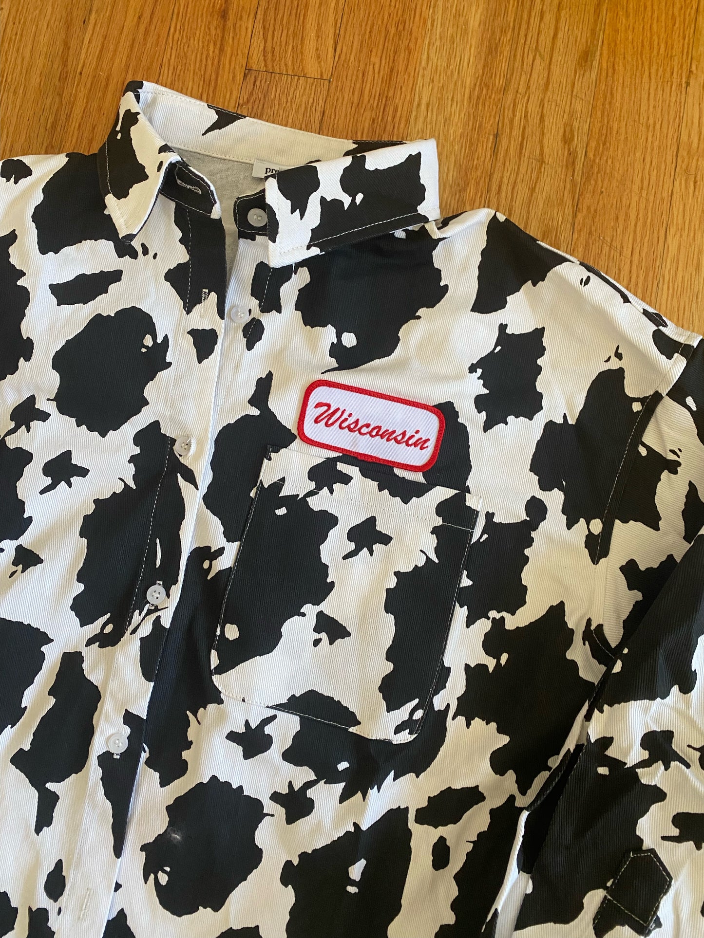 Wisconsin Name Plate Cow Print Shacket